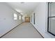Bright Florida room with carpet and sliding glass doors at 412 Cypress Forest Dr, Englewood, FL 34223