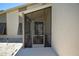Screened-in porch with metal gate and small seating area at 412 Cypress Forest Dr, Englewood, FL 34223