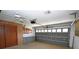Garage with storage cabinets and opener at 412 Cypress Forest Dr, Englewood, FL 34223