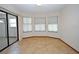 Sunroom with three windows and neutral colored tile flooring at 412 Cypress Forest Dr, Englewood, FL 34223