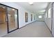 Spacious Florida room with multiple windows and carpet at 412 Cypress Forest Dr, Englewood, FL 34223