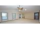 Spacious living room with high ceilings and access to the kitchen at 412 Cypress Forest Dr, Englewood, FL 34223