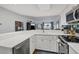 Bright kitchen with white cabinets, quartz countertops and ocean views at 5000 Gasparilla Rd # Dc102, Boca Grande, FL 33921