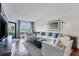 Living room with hardwood floors, comfy seating and ocean views at 5000 Gasparilla Rd # Dc102, Boca Grande, FL 33921