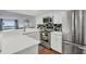 Modern kitchen with stainless steel appliances and white cabinetry at 5000 Gasparilla Rd # Dc102, Boca Grande, FL 33921