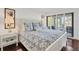 Bright bedroom with king bed and sliding doors leading to balcony at 5000 Gasparilla Rd # Dc102, Boca Grande, FL 33921