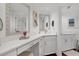 Spa-like bathroom with double vanity and large mirror at 5000 Gasparilla Rd # Dc102, Boca Grande, FL 33921