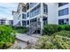 Building exterior showing walkway and landscaping at 5000 Gasparilla Rd # Dc102, Boca Grande, FL 33921