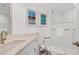 Clean bathroom with shower, toilet and white cabinets at 5000 Gasparilla Rd # Dc102, Boca Grande, FL 33921