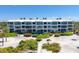 Coastal condo building with beach access and lush landscaping at 5000 Gasparilla Rd # Dc102, Boca Grande, FL 33921
