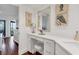 Elegant bathroom with white vanity, large mirror, and coastal decor at 5000 Gasparilla Rd # Dc102, Boca Grande, FL 33921