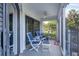 Relaxing screened porch with patio furniture and ocean views at 5000 Gasparilla Rd # Dc102, Boca Grande, FL 33921