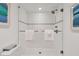Bathroom with walk-in shower, white tile, and modern fixtures at 5000 Gasparilla Rd # Dc102, Boca Grande, FL 33921