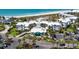 Aerial view of a resort community near the beach, featuring white buildings and parking at 5000 Gasparilla Rd # Dc102, Boca Grande, FL 33921