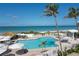 Inviting heated pool with ample lounge chairs and ocean views at 5000 Gasparilla Rd # Dc102, Boca Grande, FL 33921
