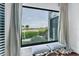 Bedroom with ocean view and comfortable seating at 5000 Gasparilla Rd # Dc102, Boca Grande, FL 33921
