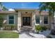 Well-maintained house exterior with double doors and landscaping at 5208 Churchill Rd, Port Charlotte, FL 33981