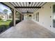 Spacious screened porch with tile flooring, ceiling fan, and backyard views at 5208 Churchill Rd, Port Charlotte, FL 33981