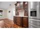 Kitchen features dark wood cabinets and granite countertops at 5208 Churchill Rd, Port Charlotte, FL 33981