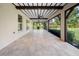 Large screened porch with tile floor, ceiling fan and access to backyard at 5208 Churchill Rd, Port Charlotte, FL 33981