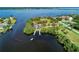 Aerial view showcasing waterfront property with boat access at 5208 Churchill Rd, Port Charlotte, FL 33981