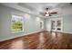 Serene bedroom boasting hardwood floors and abundant natural light at 5208 Churchill Rd, Port Charlotte, FL 33981