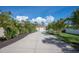 Long driveway leading to a two-car garage at 5208 Churchill Rd, Port Charlotte, FL 33981
