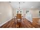 Cozy dining room with hardwood floors, a chandelier, and natural light at 5208 Churchill Rd, Port Charlotte, FL 33981