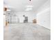 Spacious garage interior with high ceilings and ample storage at 5208 Churchill Rd, Port Charlotte, FL 33981