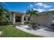 Charming house exterior with double doors and landscaping at 5208 Churchill Rd, Port Charlotte, FL 33981