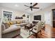 Inviting living room features a comfortable sofa, stylish decor, and hardwood flooring at 5208 Churchill Rd, Port Charlotte, FL 33981