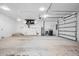 Spacious garage with ample storage and workshop area at 5208 Churchill Rd, Port Charlotte, FL 33981