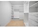 Large walk-in closet with ample shelving and drawers at 5208 Churchill Rd, Port Charlotte, FL 33981