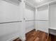 Large walk-in closet with double hanging rods and shelving at 5208 Churchill Rd, Port Charlotte, FL 33981