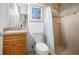 Small bathroom with shower, toilet and vanity at 5208 Churchill Rd, Port Charlotte, FL 33981