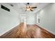 Spacious bedroom with hardwood floors and access to another room at 5208 Churchill Rd, Port Charlotte, FL 33981