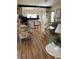 Bright living room featuring laminate floors and comfy seating at 5560 Holiday Park Blvd, North Port, FL 34287