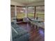 Relaxing sunroom with wicker furniture and large windows at 5560 Holiday Park Blvd, North Port, FL 34287