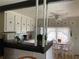 Cozy kitchen with white cabinets and a breakfast nook at 5560 Holiday Park Blvd, North Port, FL 34287