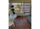 Bright sunroom with seating and large windows at 5560 Holiday Park Blvd, North Port, FL 34287
