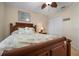 Comfortable bedroom with a full-size bed and ceiling fan at 665 Rotonda Cir, Rotonda West, FL 33947