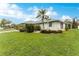 Single-story home with lush landscaping at 7012 Denmark St, Englewood, FL 34224