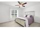 Main bedroom with a queen-size bed and ceiling fan at 7098 Muncey Rd, North Port, FL 34291