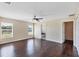 Spacious main bedroom with dark hardwood floors and ceiling fan at 10459 Alexandria Ave, Englewood, FL 34224