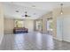 Spacious living room with tile floors and a daybed at 10459 Alexandria Ave, Englewood, FL 34224