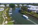 Aerial view of community with boat traffic on the canal at 11000 Placida Rd # 308, Placida, FL 33946