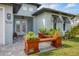 Front porch with a wooden bench and potted plants at 137 Wahoo Dr, Rotonda West, FL 33947