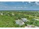 Aerial view showcasing a house and surrounding landscape at 14080 Willow Glen Ct # 233, Port Charlotte, FL 33953