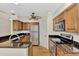 Modern kitchen with stainless steel appliances and granite countertops at 14080 Willow Glen Ct # 233, Port Charlotte, FL 33953