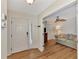 Light and bright entryway with hardwood floors and access to living room at 14080 Willow Glen Ct # 233, Port Charlotte, FL 33953